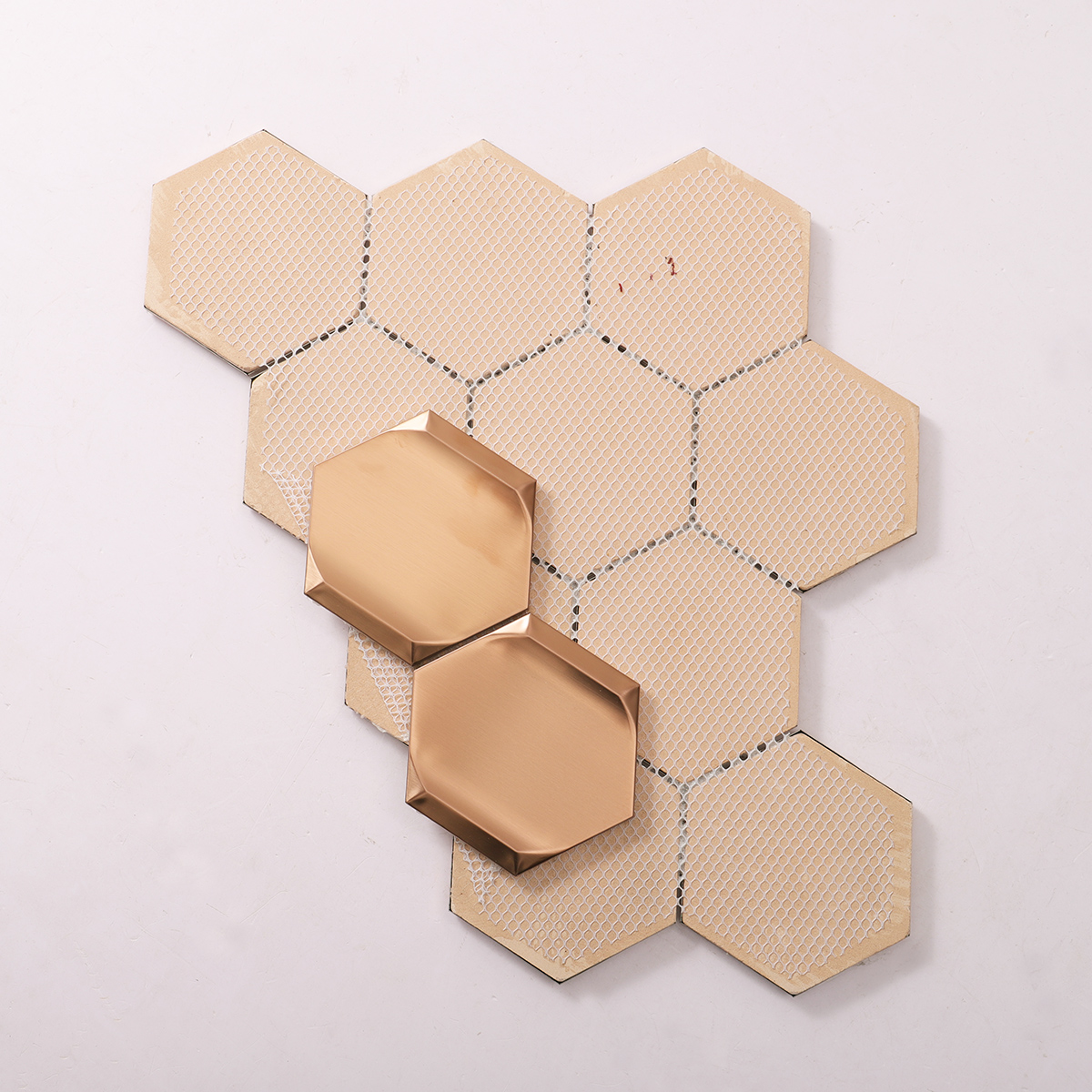 Folded back side of rose gold 3D stainless steel hexagon mosaic tiles.