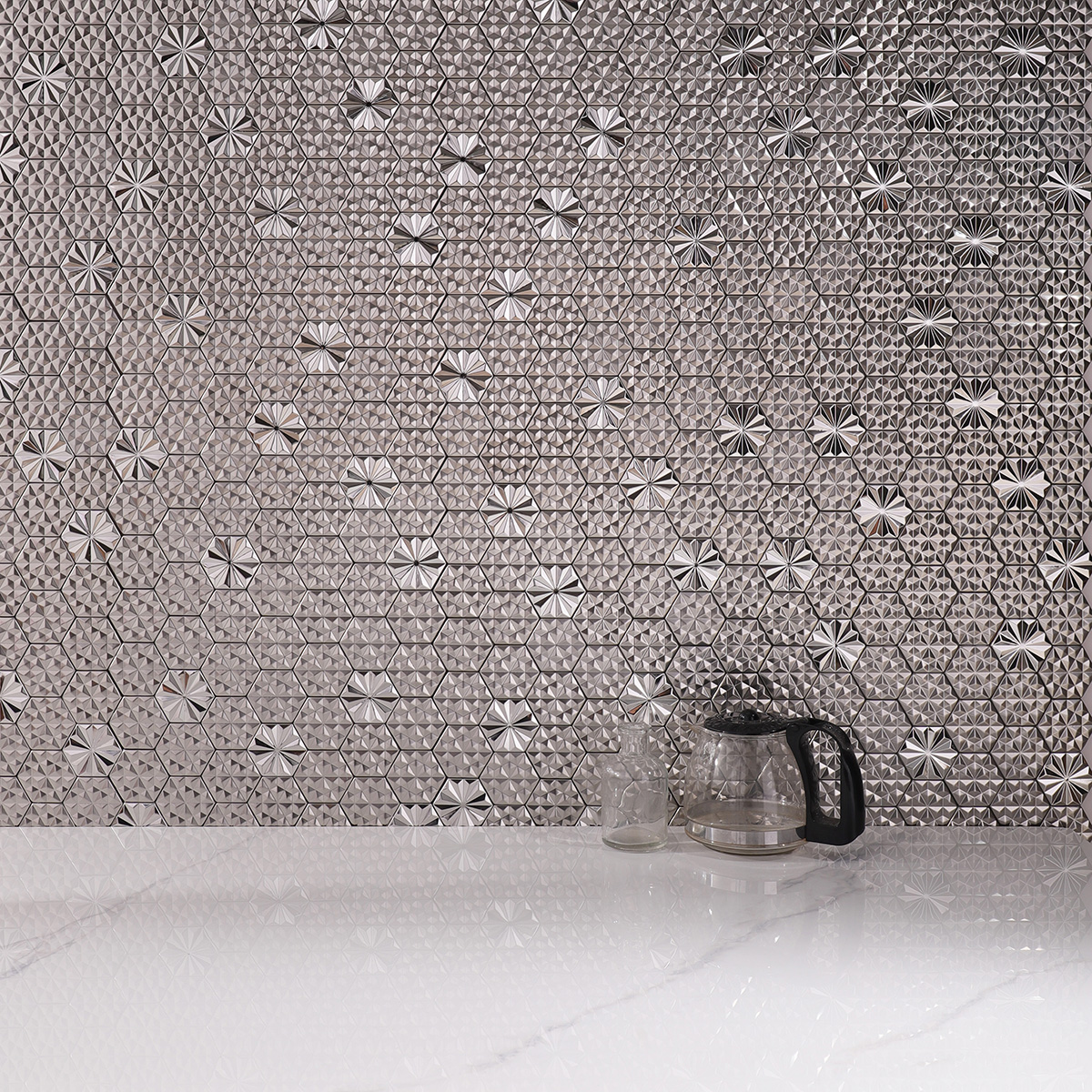 Silver hexagon 3D metal mosaic tiles on a modern kitchen backsplash with white floor tiles.