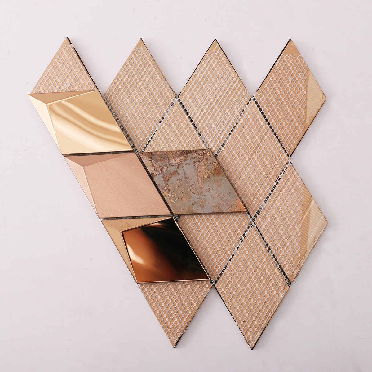 Folded back side of 3D diamond stainless steel and copper mosaic tiles.