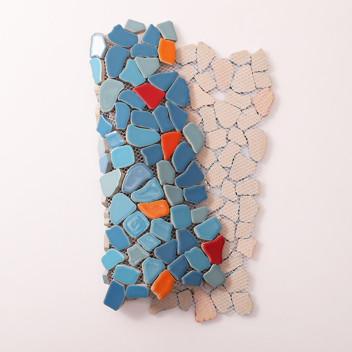 Folded back side of irregular ceramic pebble cracked mosaic tiles
