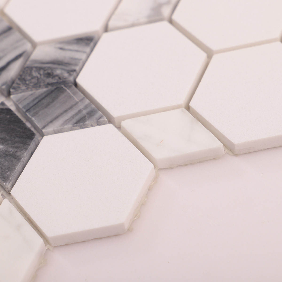 Side close-up view of white and grey flower marble mosaic tiles, showing texture and thickness