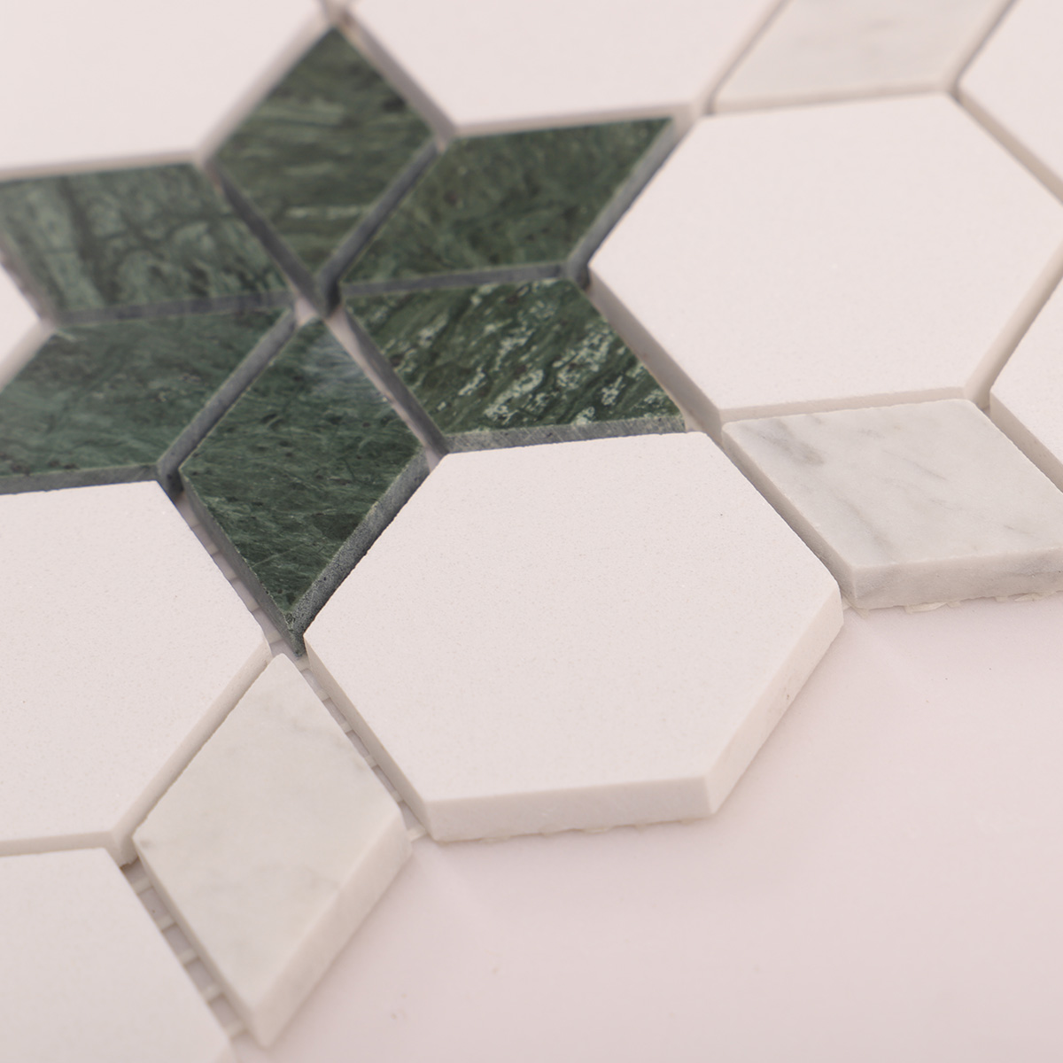 Side close-up view of green and white floral marble mosaic tiles, showing texture and thickness.