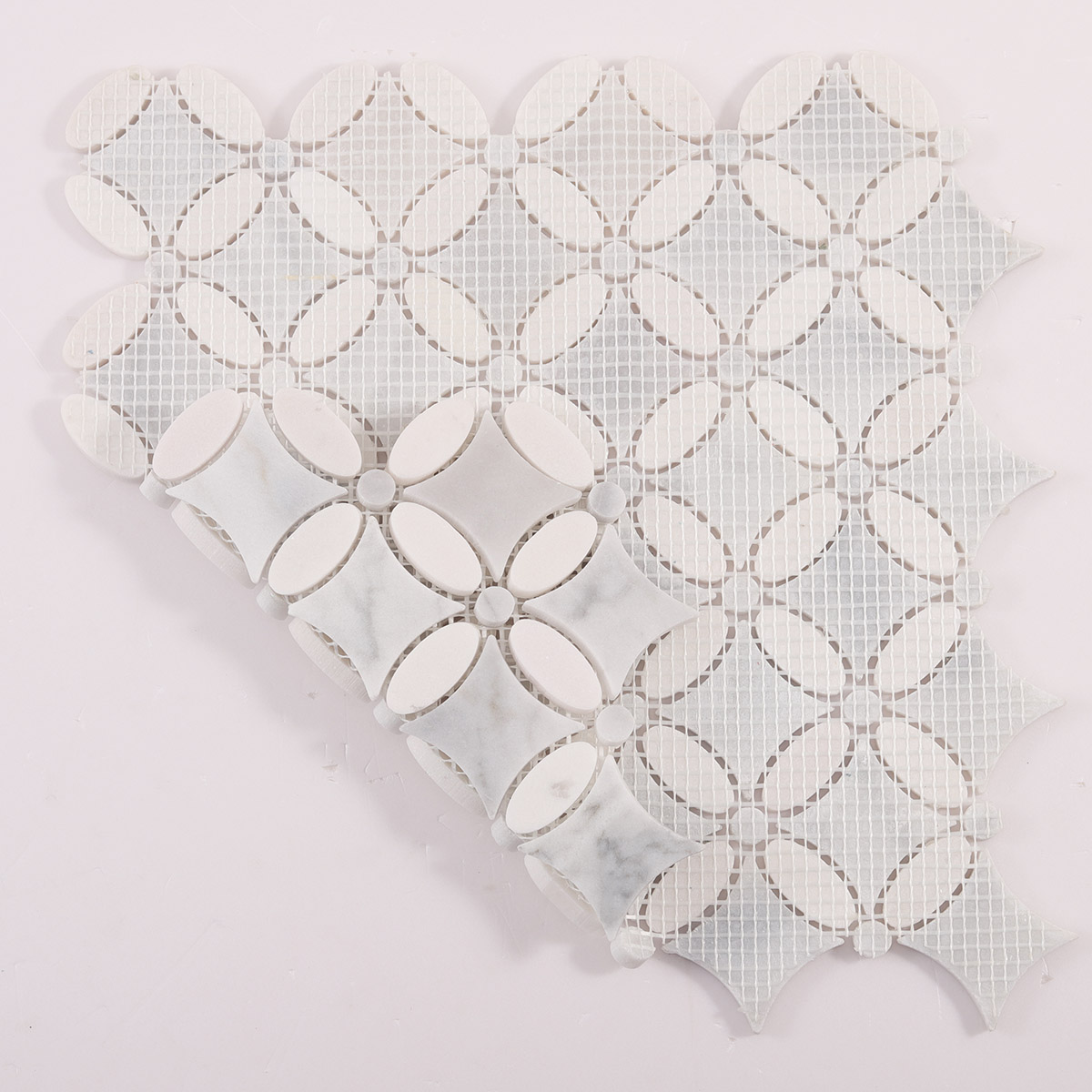 Folded back side of Carrara white flower marble mosaic tiles