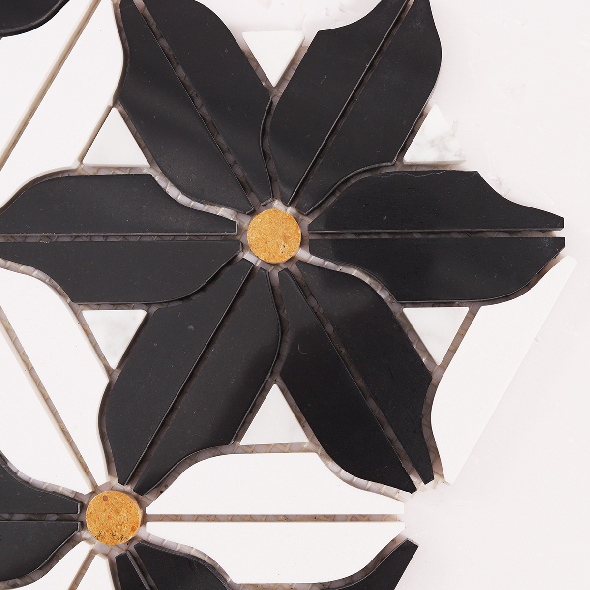 Close-up view of black and white flower marble mosaic tiles