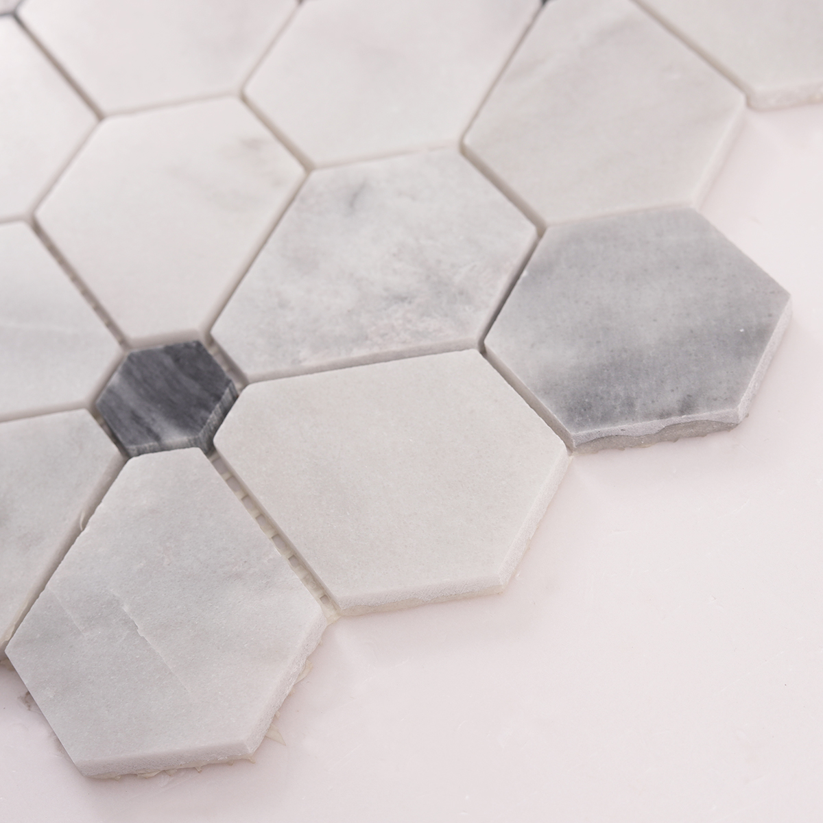 Side close-up view of Carrara white hexagon flower marble mosaic tiles