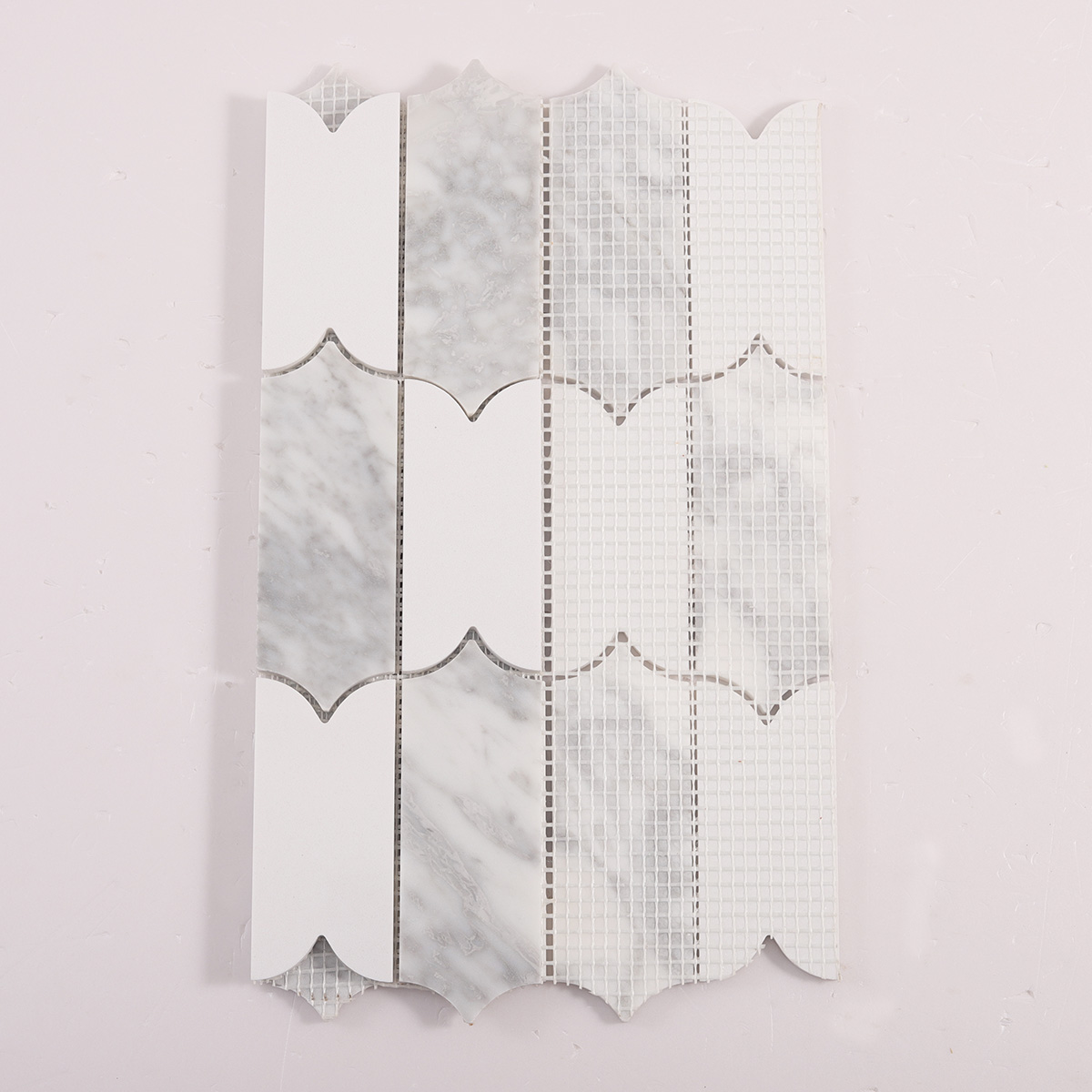 Back side of Carrara white natural stone mosaic tiles, folded