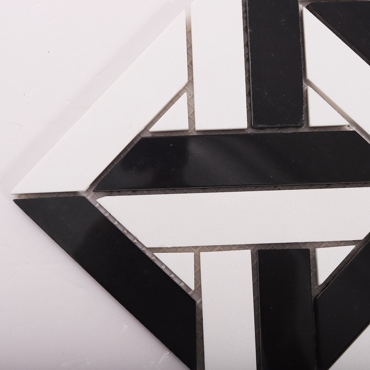 Close-up of White and Black Geometrica polished marble mosaic tiles