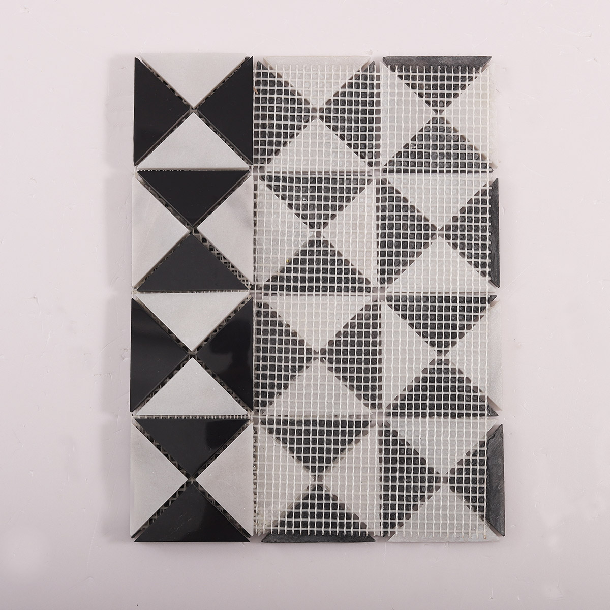 Folded back side of Carrara White and Black Triangle Windmill marble mosaic tiles
