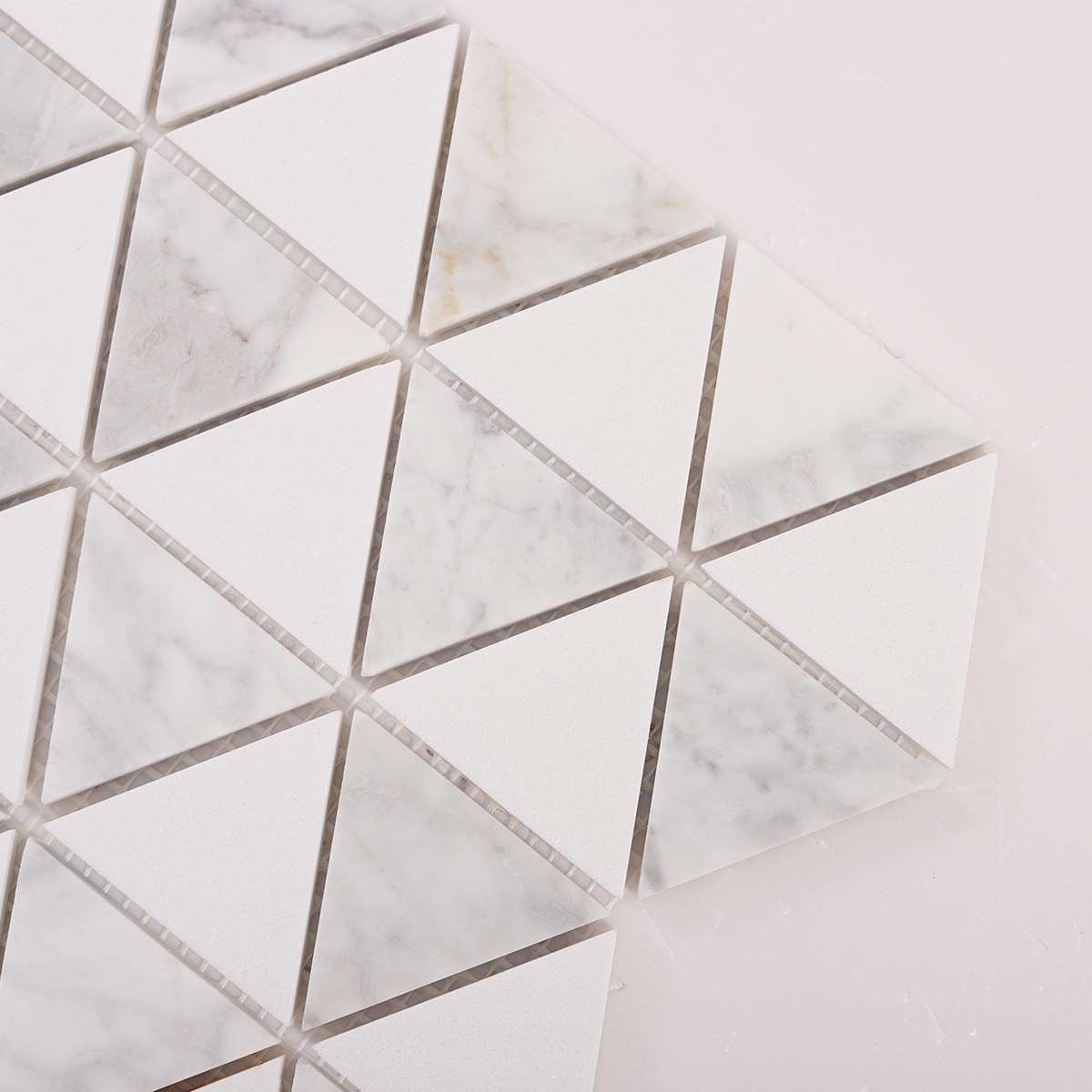 Detailed close-up of White Equilateral Triangle Honed Stone Mosaic Tiles