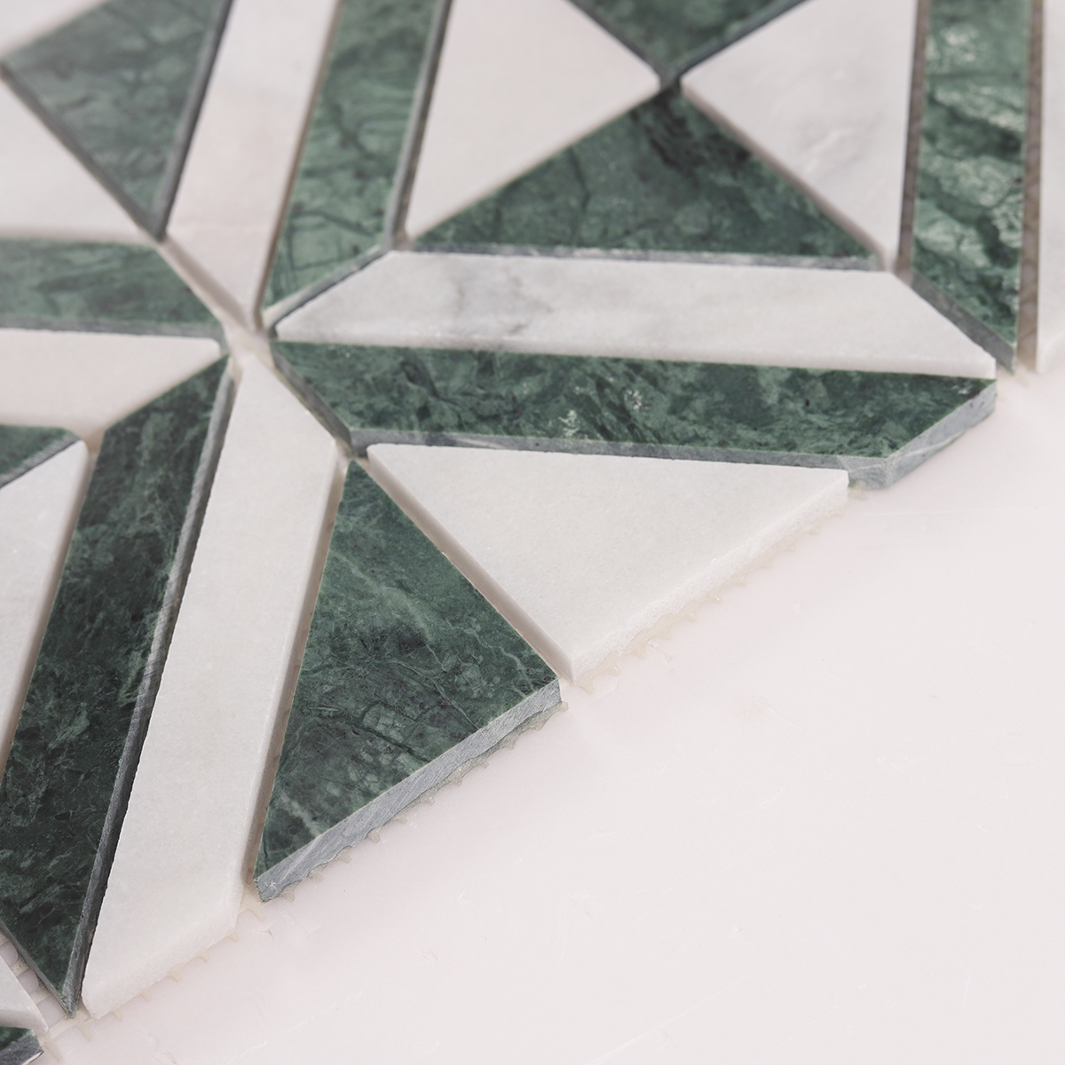 Side close-up view of Green & White Triangle Marble Mosaic Tiles, showing texture and thickness.