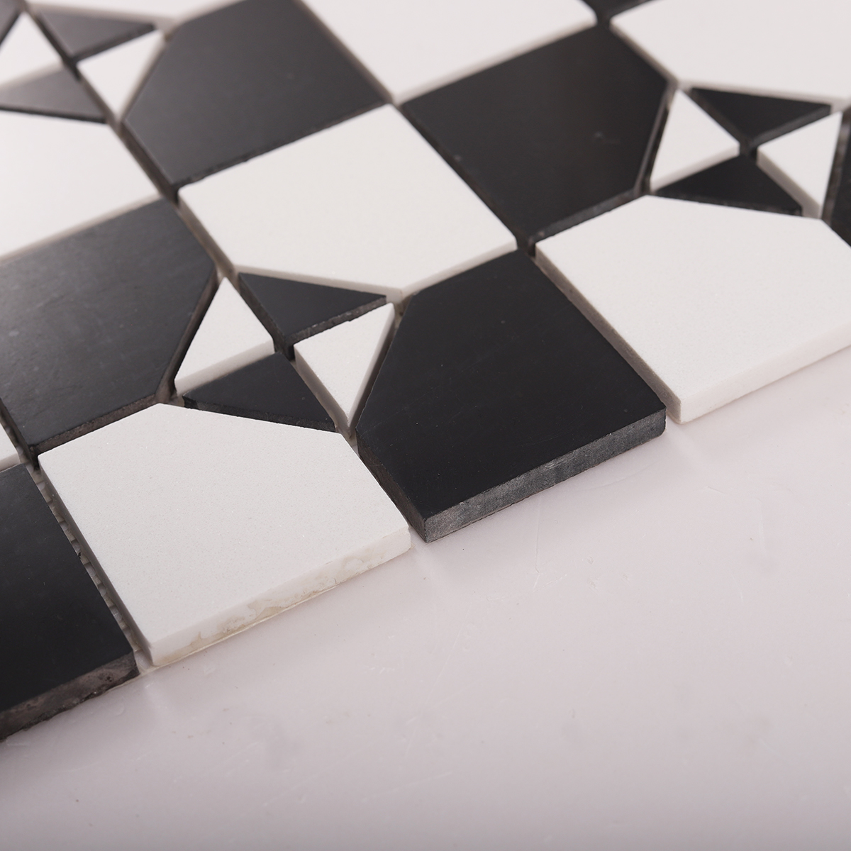 Side close-up view of Black and White Polished Marble Mosaic Tiles, showing texture and thickness