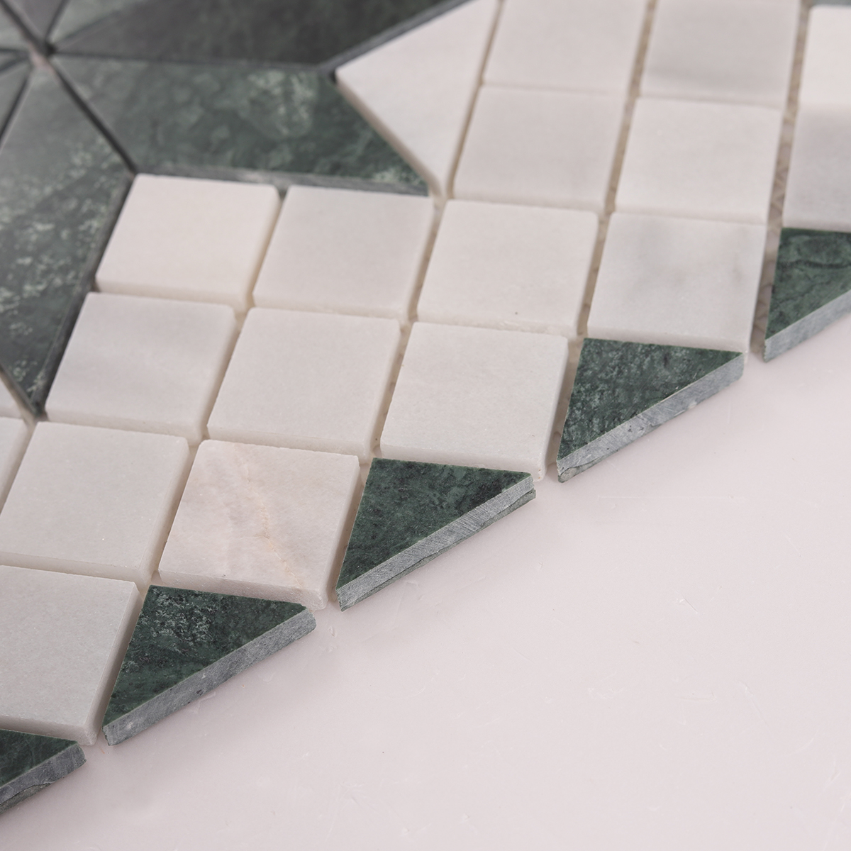 Side close-up view of Carrara White & Green Star Marble Mosaic Tiles, showing texture and thickness