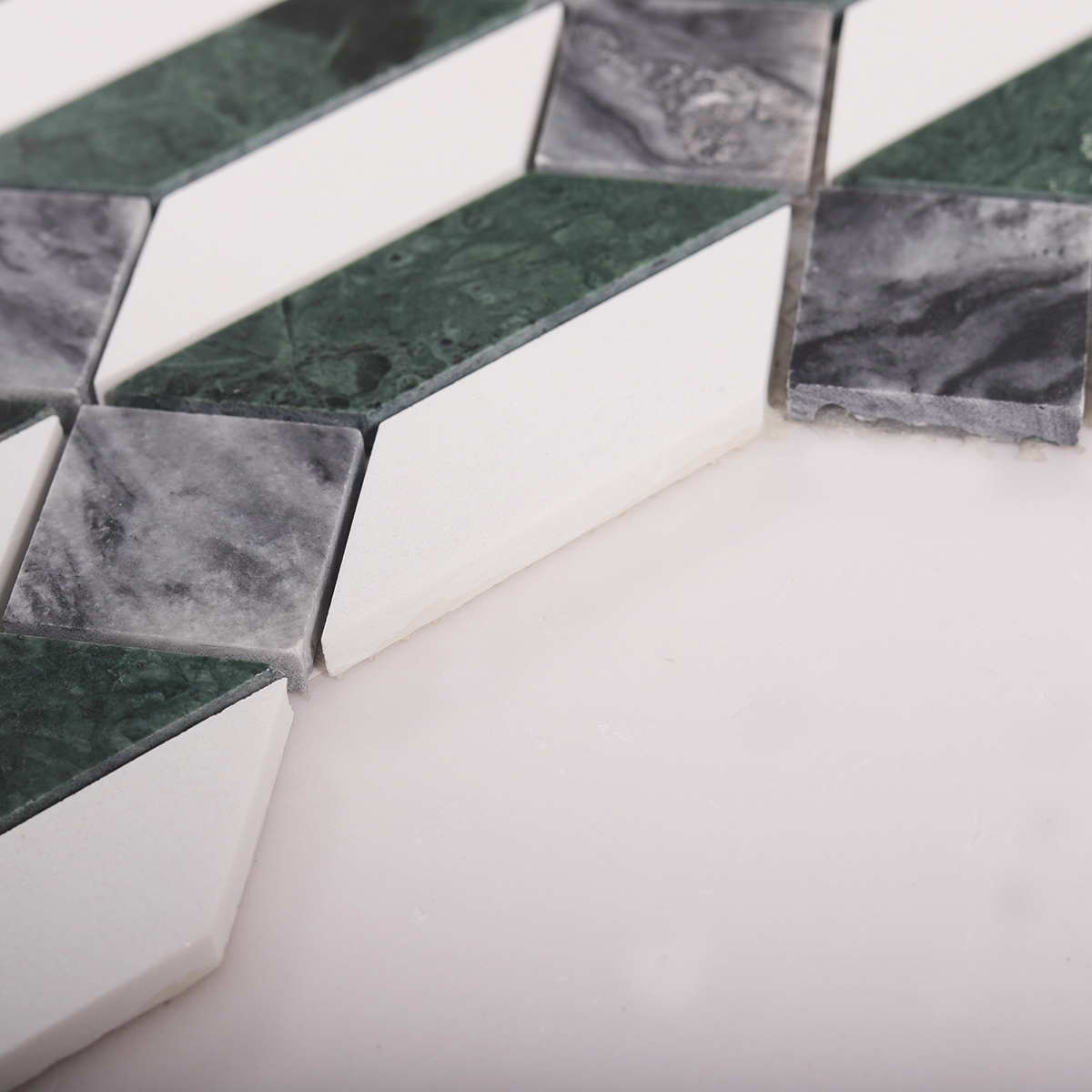 Side close-up view of Green and White Picket Marble Mosaic Tiles, showing texture and thickness.