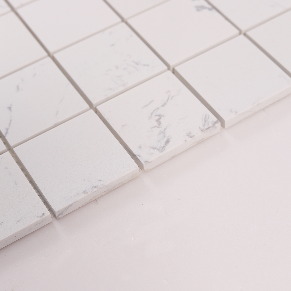 Side close-up view of White Square Polished Marble Mosaic Tiles, showing texture and thickness