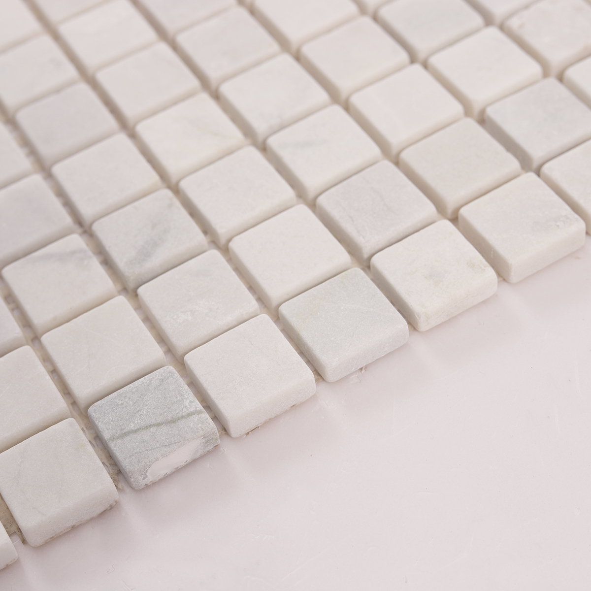 Side close-up view of Thassos White Square Marble Mosaic Tiles, showing texture and thickness