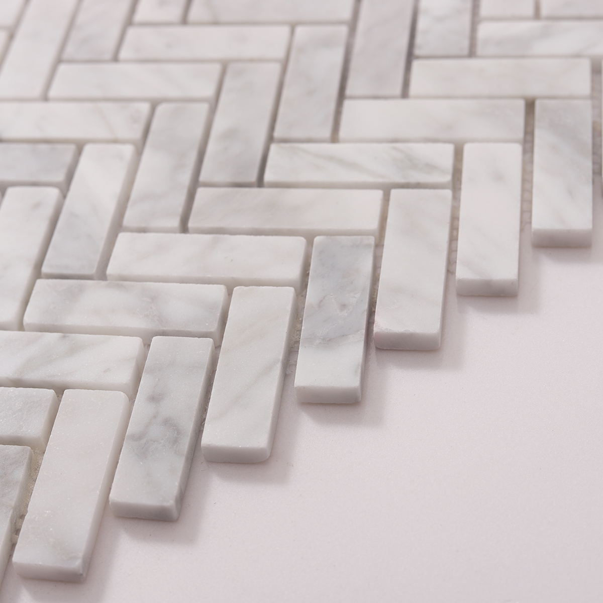 Side view close-up of Carrara White Herringbone Marble Polished Mosaic Tiles