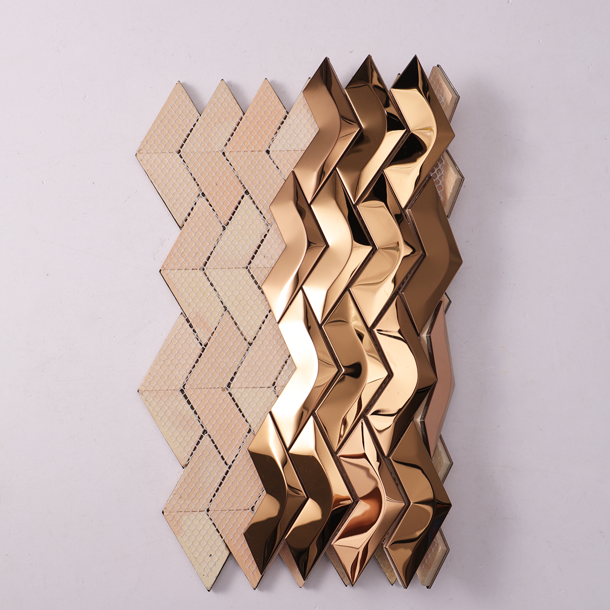 3D Herringbone Rose Gold Mirror Metal Mosaic Wall Tile, back side with fold visible