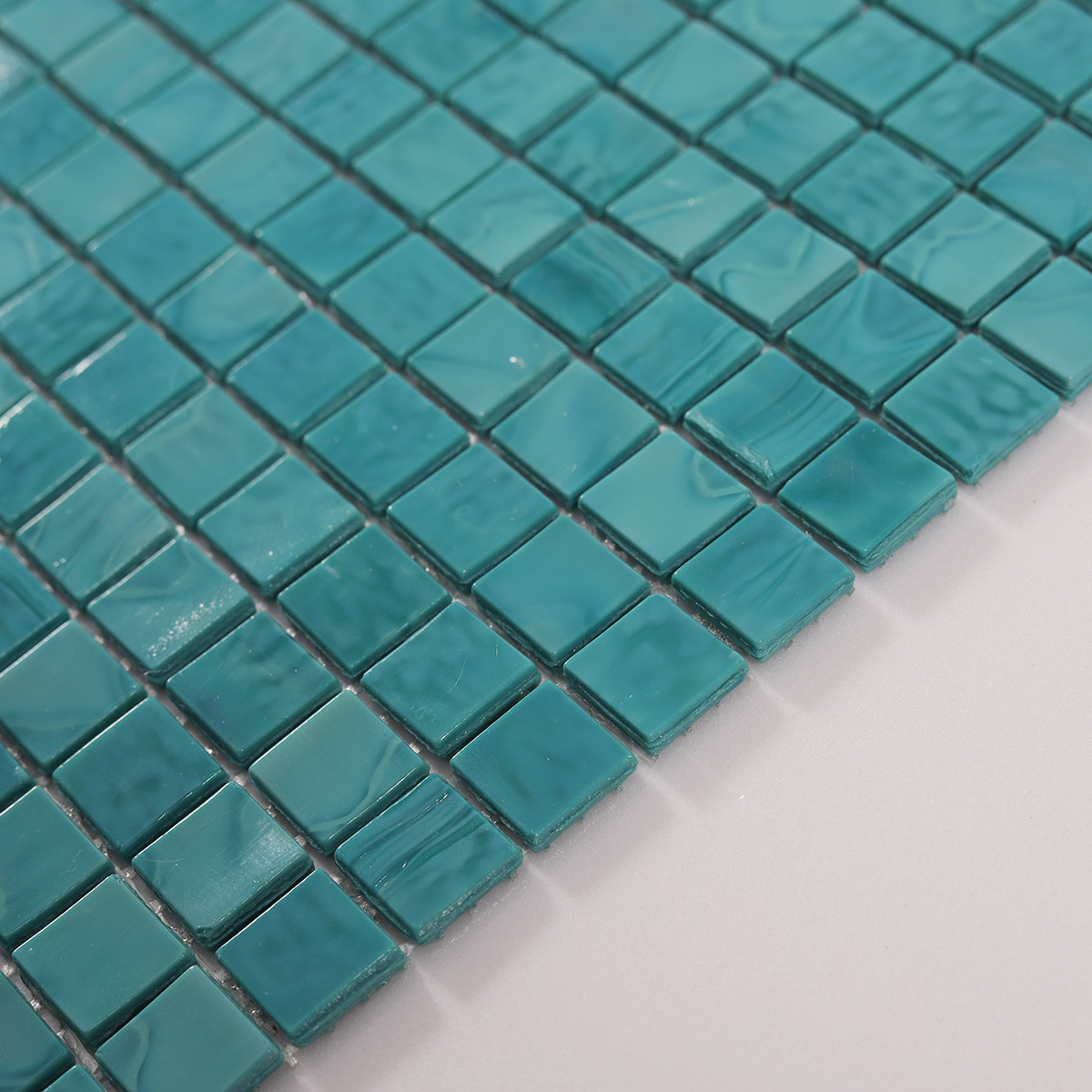 Side view close-up of Light Blue Square Glass Mosaic Pool Tile, edge detail