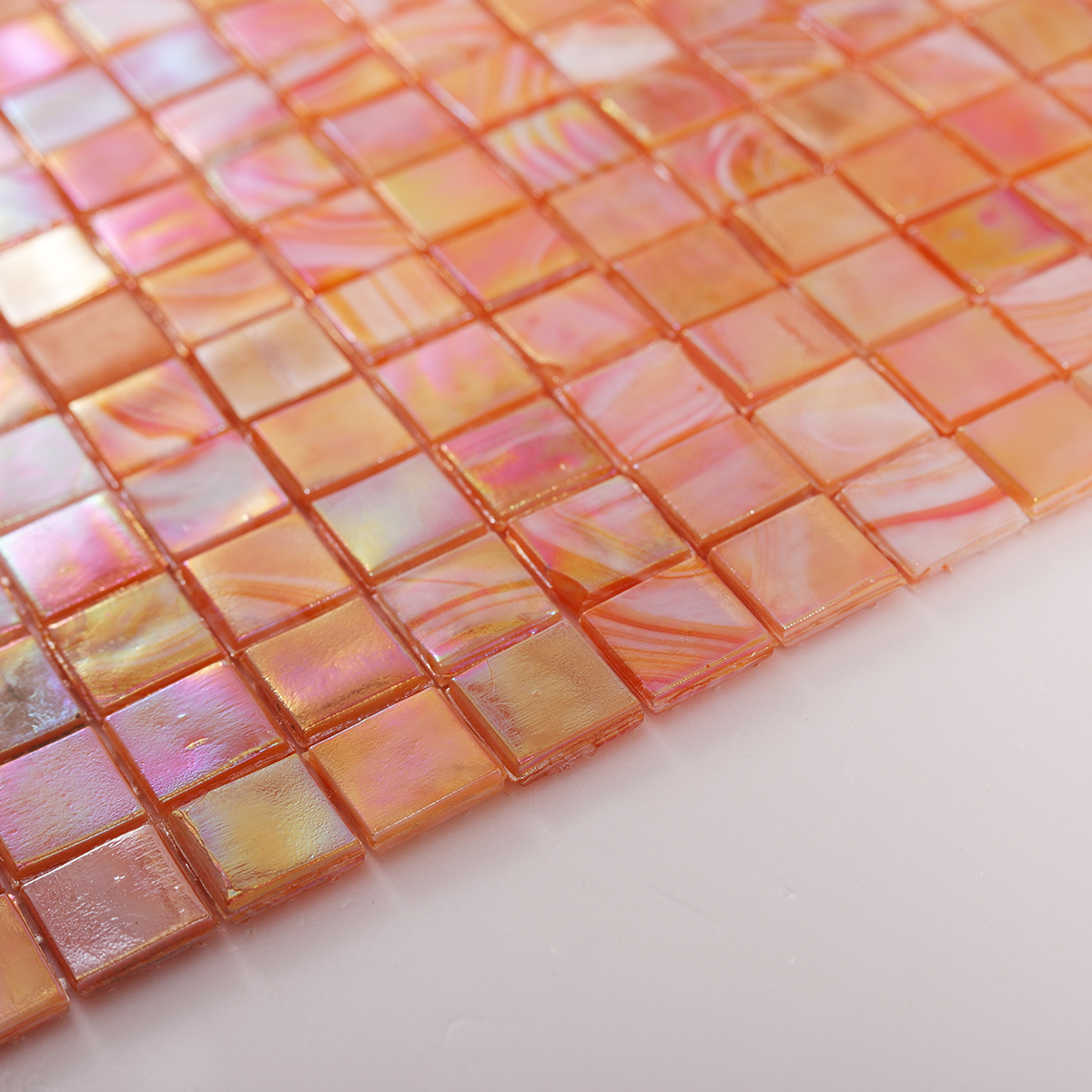 Side view close-up of Burnt Orange Iridescent Glass Mosaic Tile, edge detail