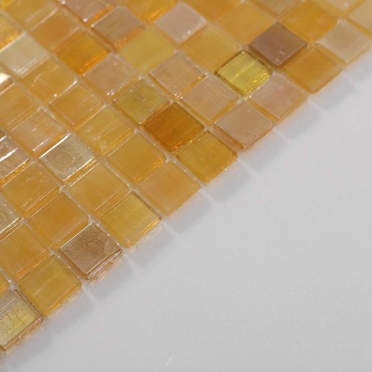 Side view close-up of Glimmer Translucent Yellow Square Glass Mosaic Tiles, edge detail