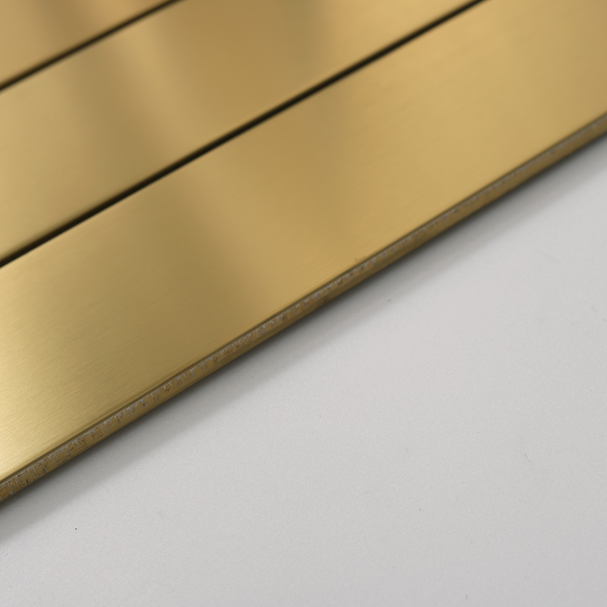 Side view close-up of Large Rectangle Gold Brushed Metal Mosaic Tiles, edge detail