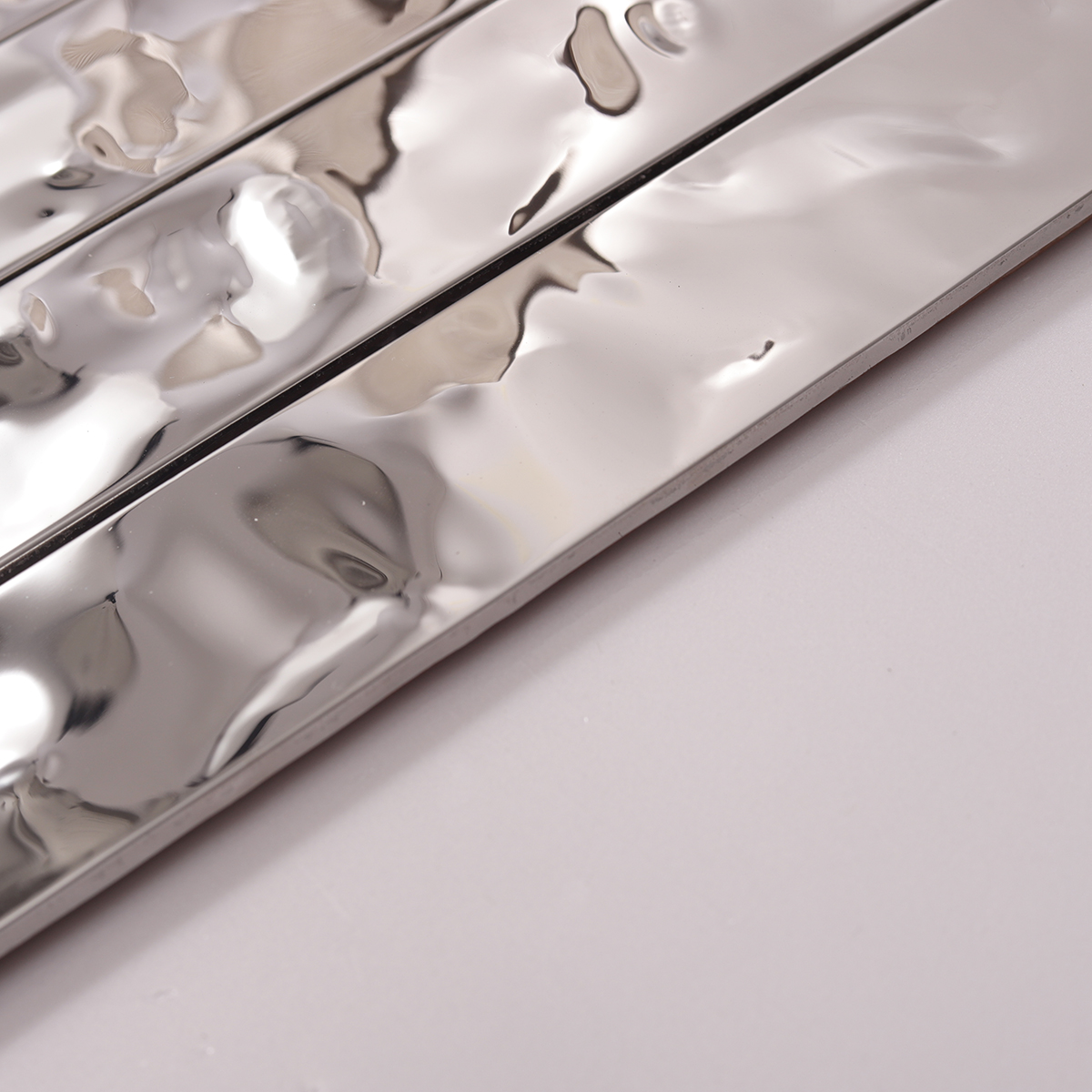 Side view close-up of Silver Stainless Steel Stacked Mosaic Tiles, edge detail