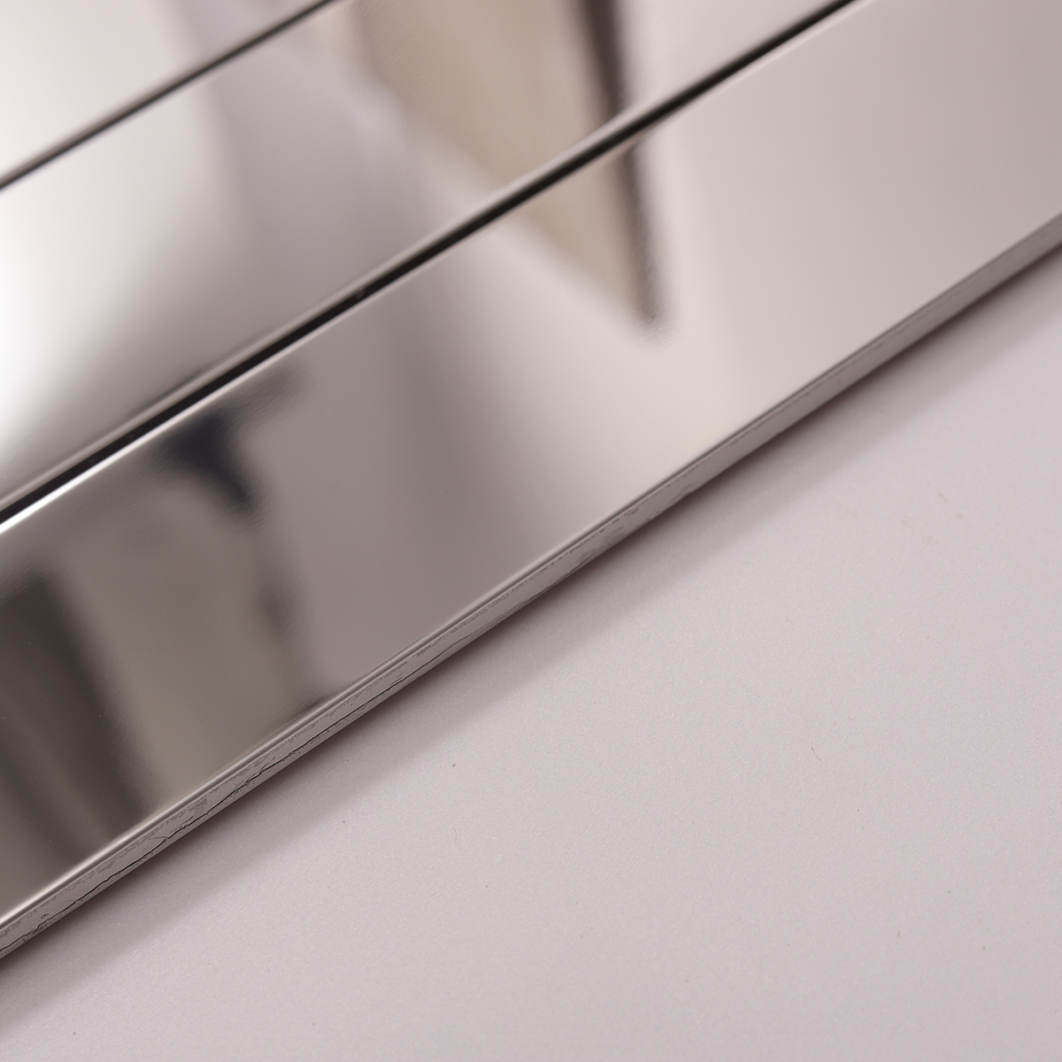 Side view close-up of Mirrored Rectangle Strip Metal Silver Mosaic Tiles, edge detail