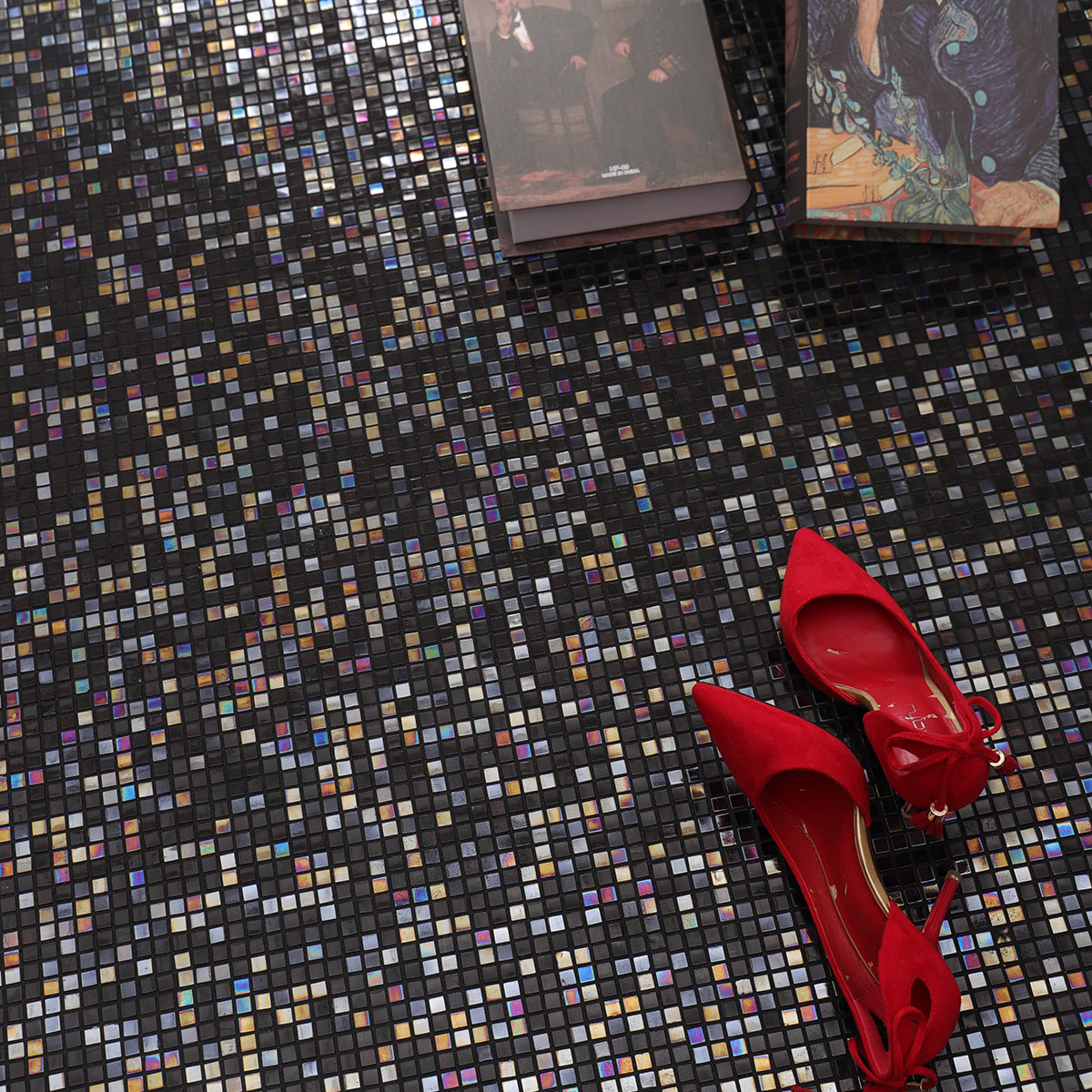 Mini Black Square Iridescent Glass Mosaic Tiles on the floor, with red high heels and books 
