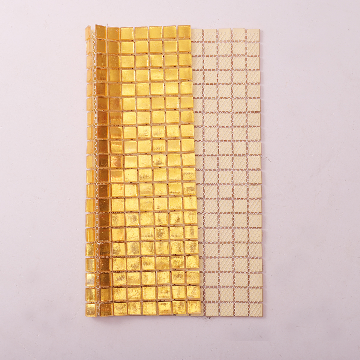 Glossy Gold Square Glass Mosaic Tile, back side with fold visible