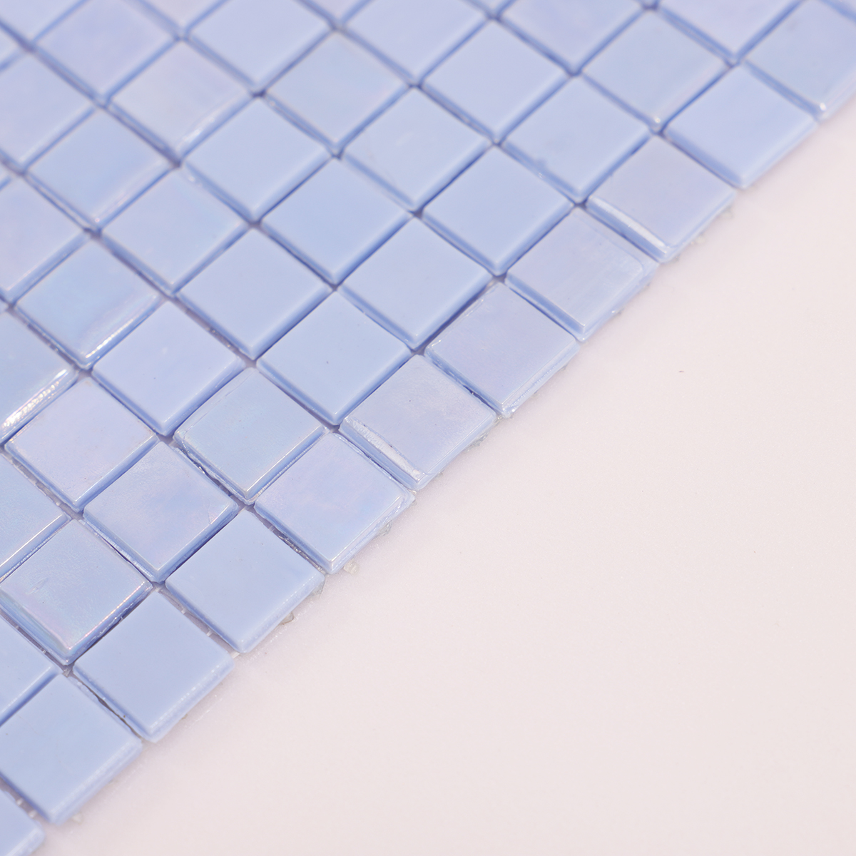 Side view close-up of Ocean Blue Iridescent Glass Mosaic Pool Tile