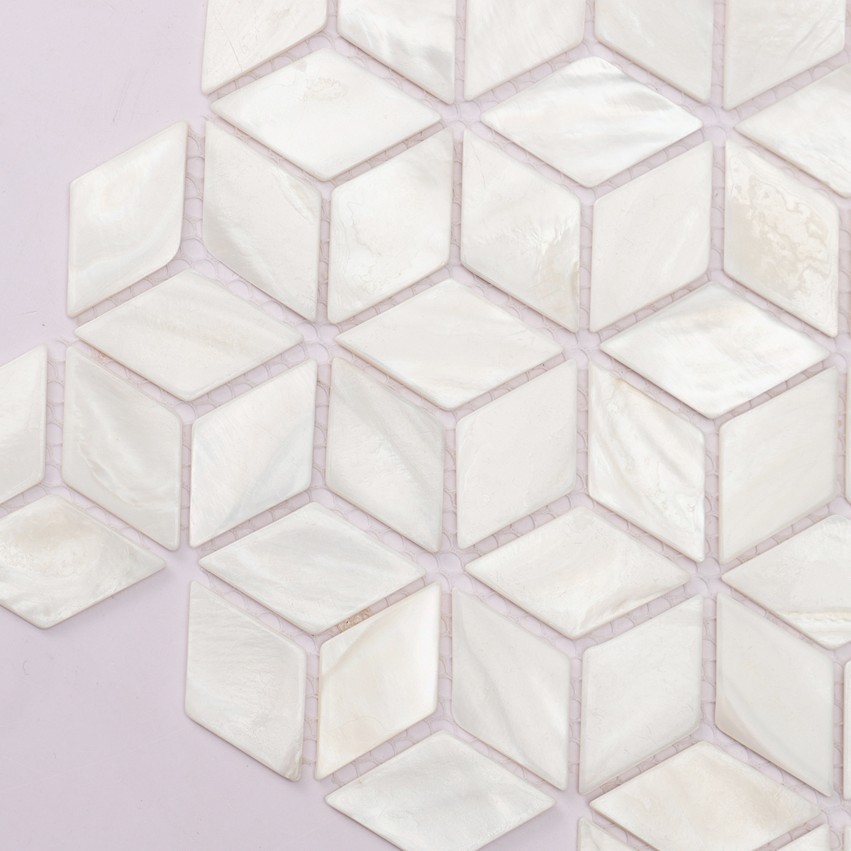 Close-up of white mother of pearl diamond mosaic tiles.