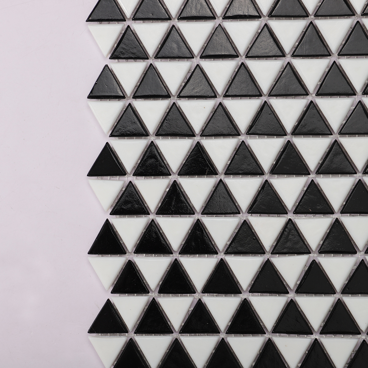 Close-up of Black and White Triangle Shaped Glass Mosaic Tile