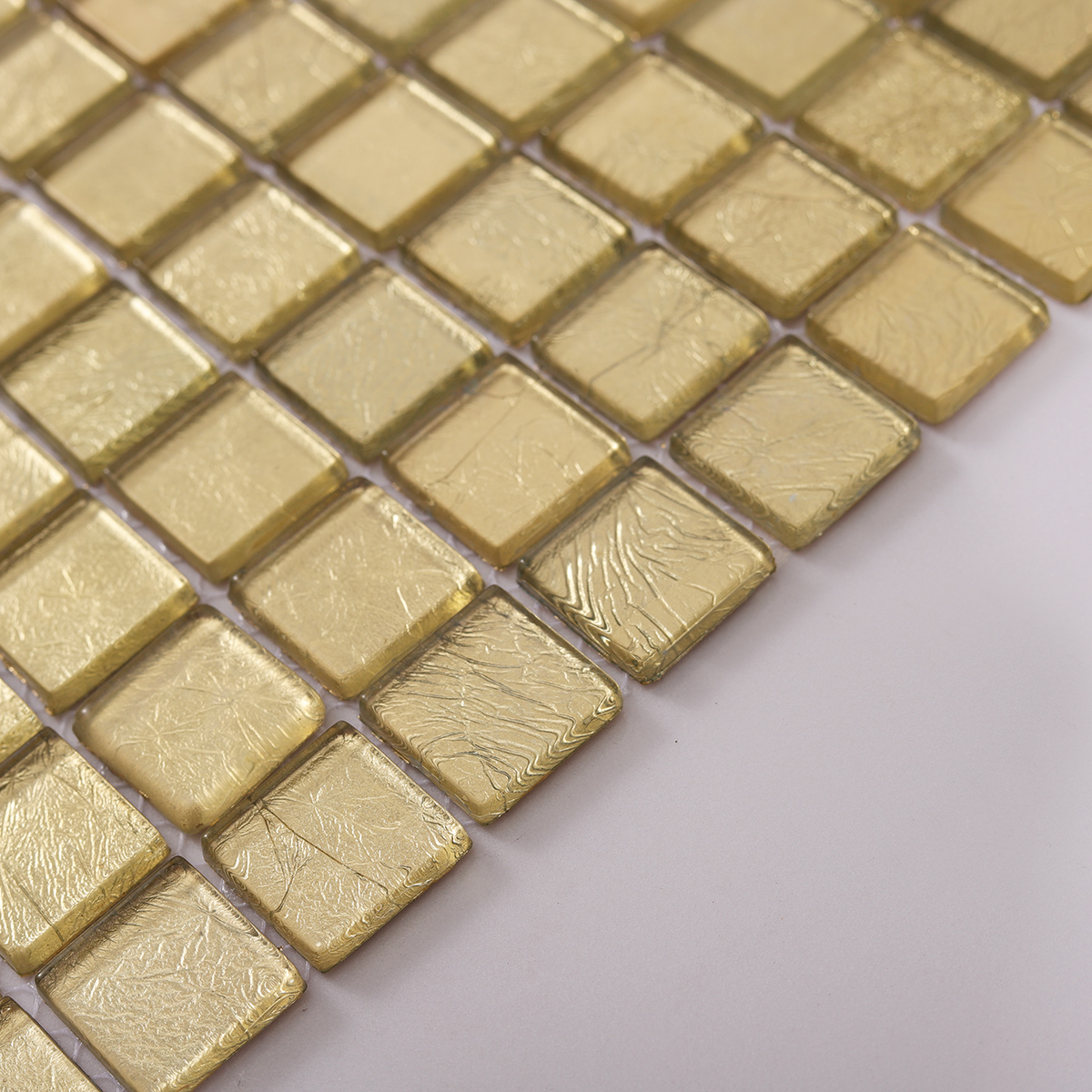 Side View Showing Thickness of Glossy Gold Square Glass Mosaic Tile
