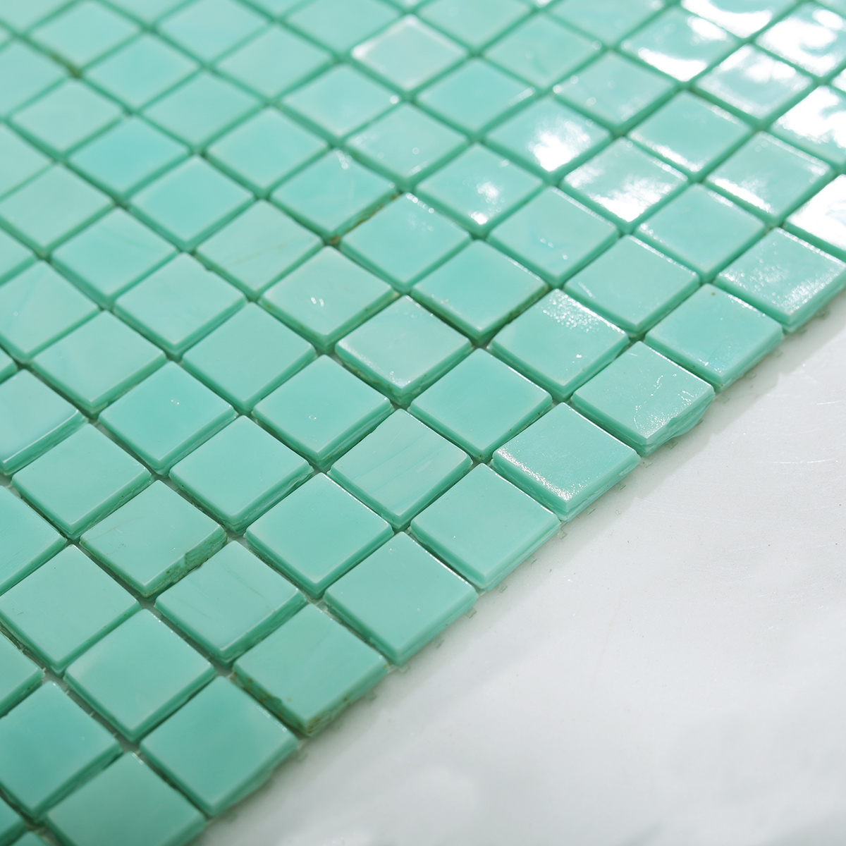 Side View Showing Thickness of Teal Square Mosaic Backsplash Tile