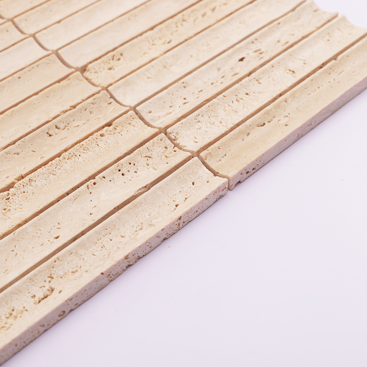 Side view of beige travertine mosaic tile showing thickness