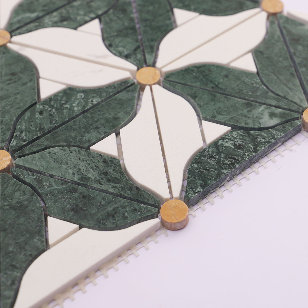Side view showing the thickness of the green and white marble flower mosaic tiles