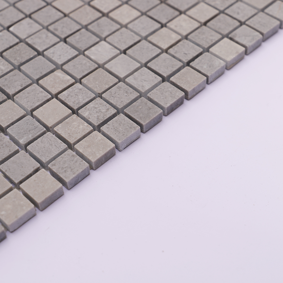 Side view showing the thickness of the gray square polished marble tiles.