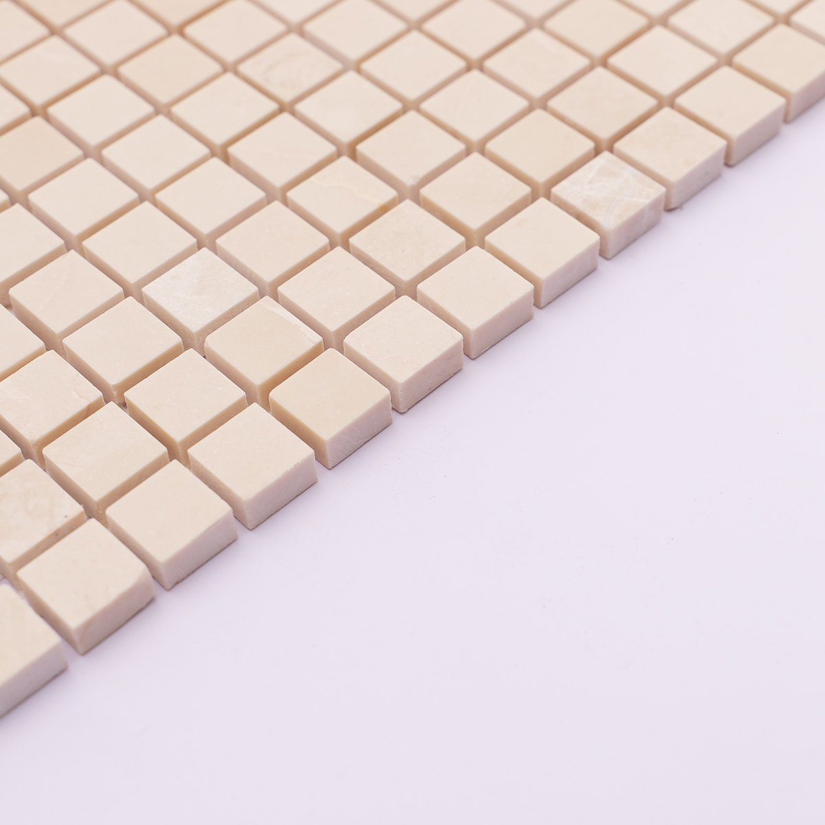 Side view showing the thickness of beige square polished marble tiles.