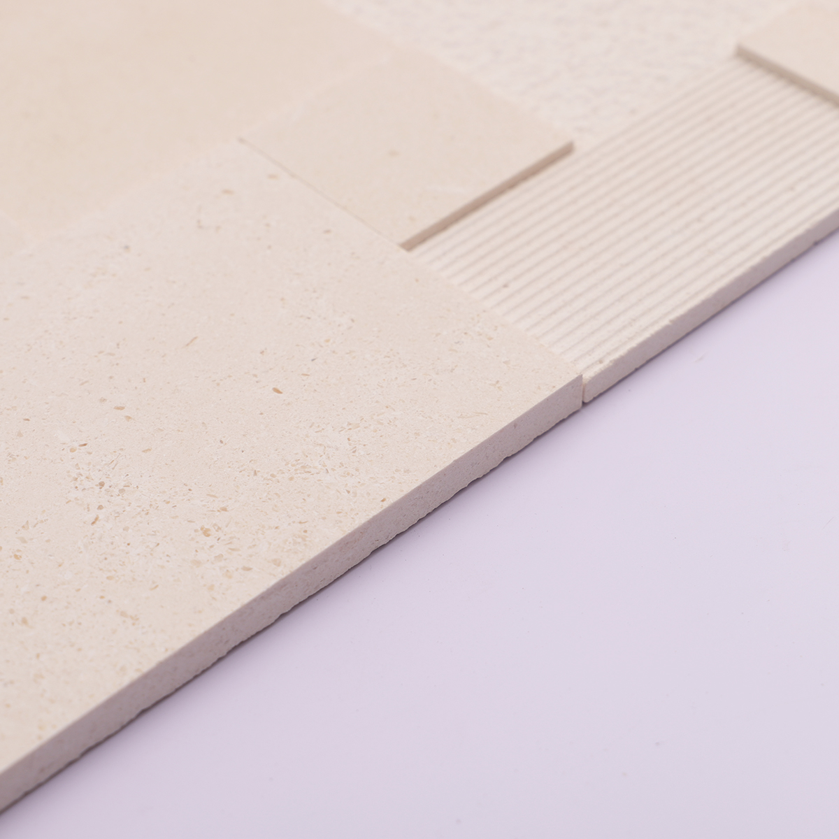 Side view showing the thickness of 3D beige marble mosaic tiles