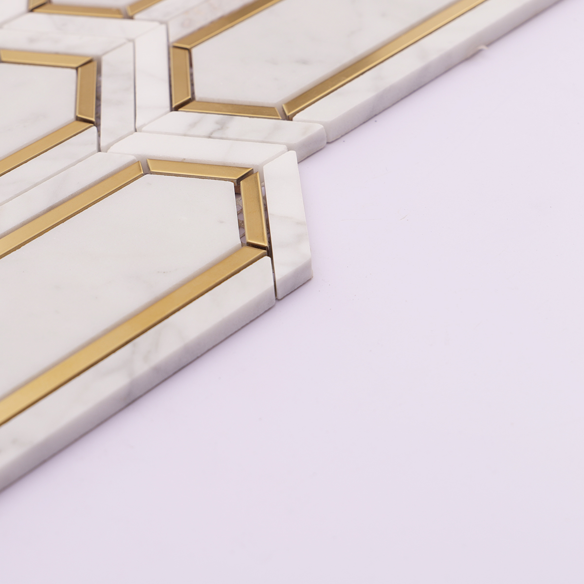 Side view showing the thickness of the Carrara white and gold metal picket marble mosaic tiles.