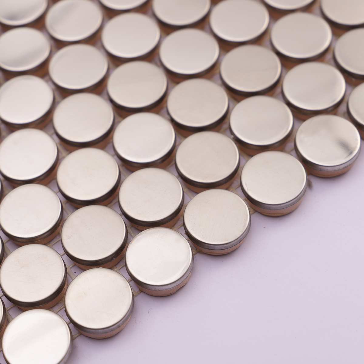  Side angle showing the thickness of silver penny round stainless steel mosaic tiles.
