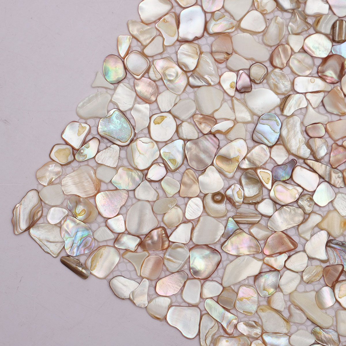 Close-up view of Mother of Pearl random tiny pebble mosaic tiles.