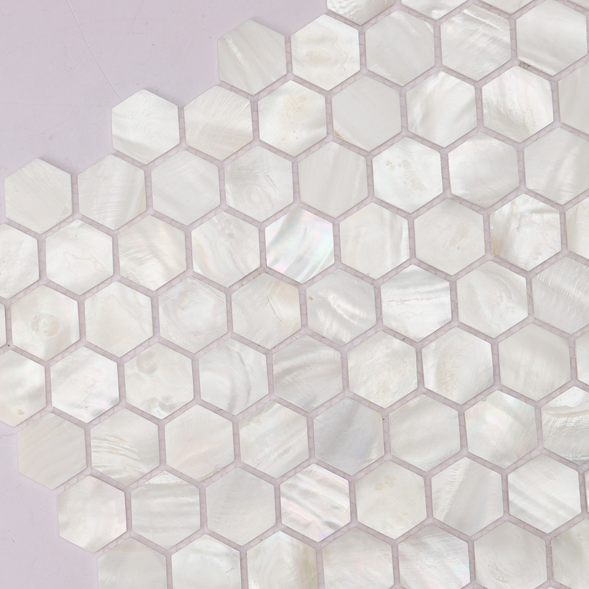 Close-up of white hexagon mother of pearl mosaic tiles (angle 2).