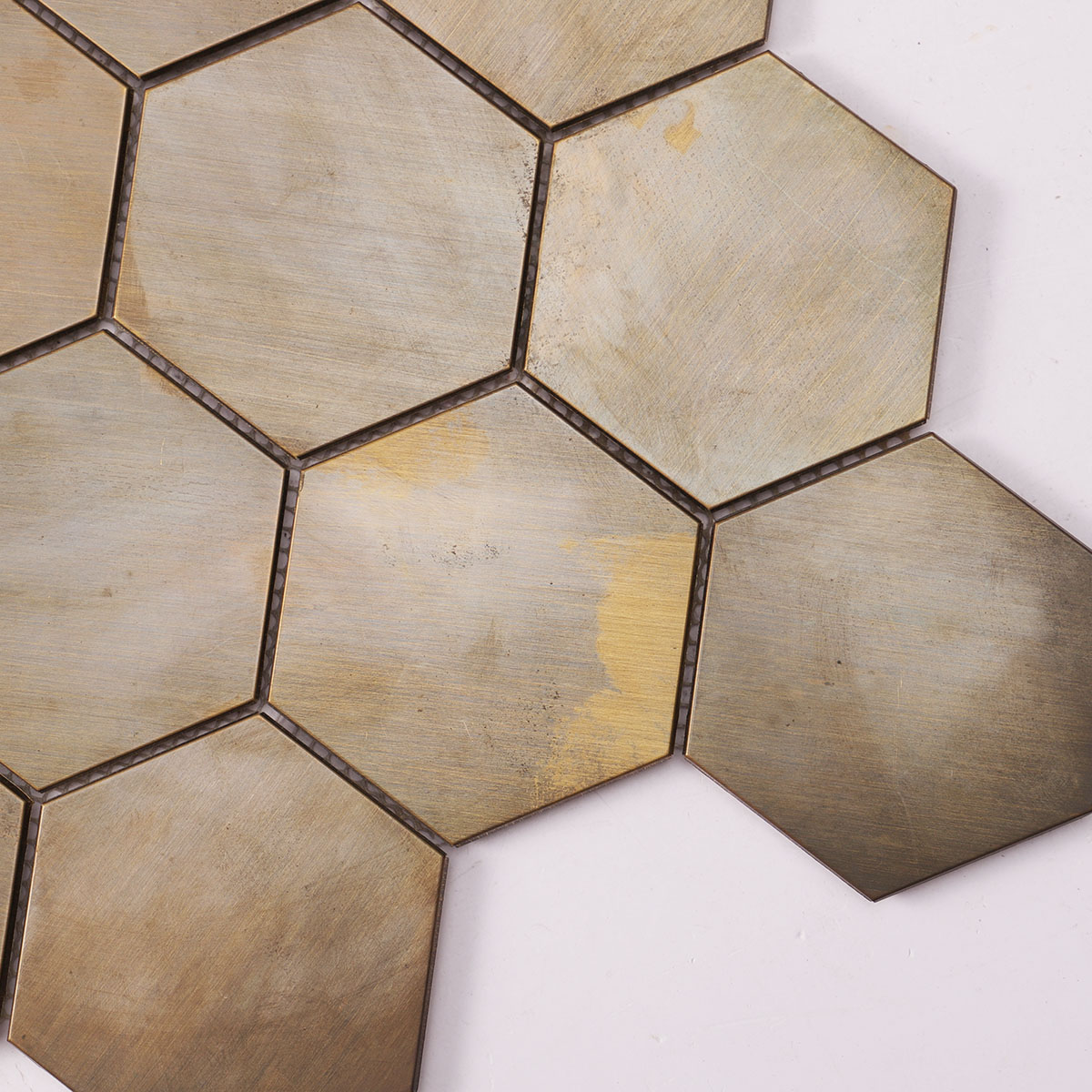 Close-up of copper hexagon mosaic wall tile