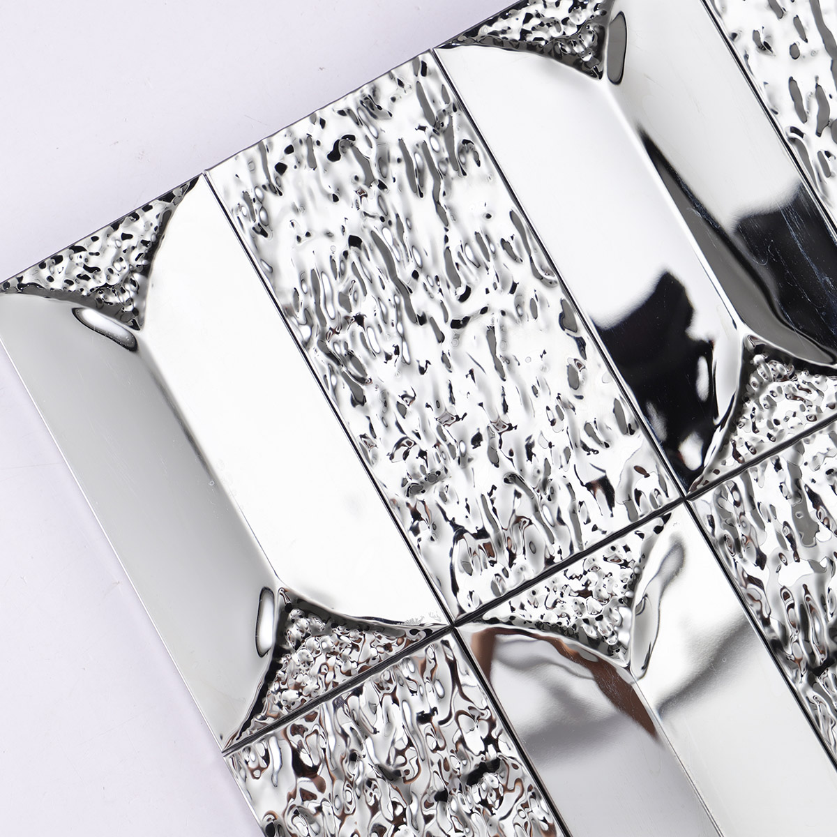 Close-up of 3D stainless silver rectangle mosaic tiles