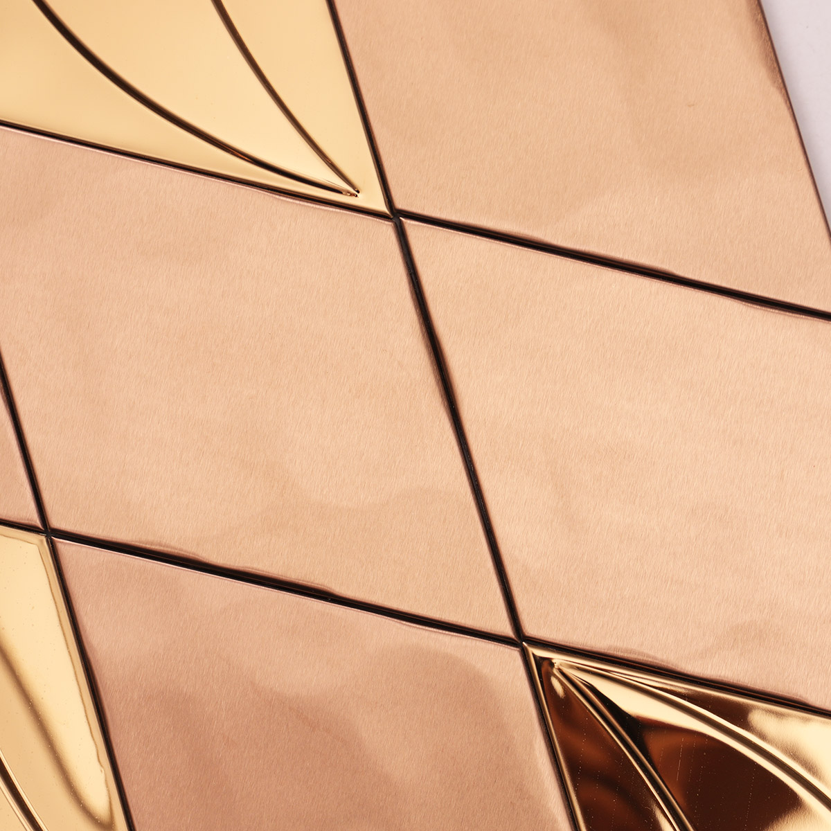 Close-up of the middle of rose gold diamond metal mosaic tiles