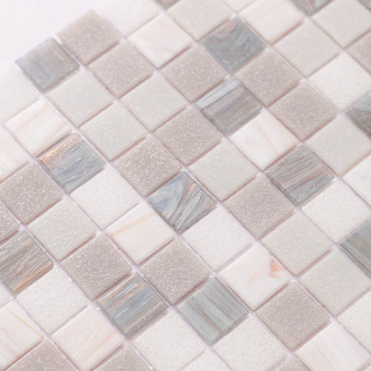 Detailed close-up of gray and white glass mosaic tiles