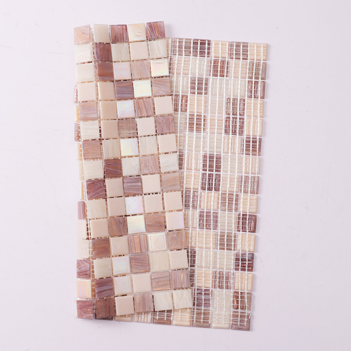 Folded back side of purple and pale pink uniform square glass mosaic tiles