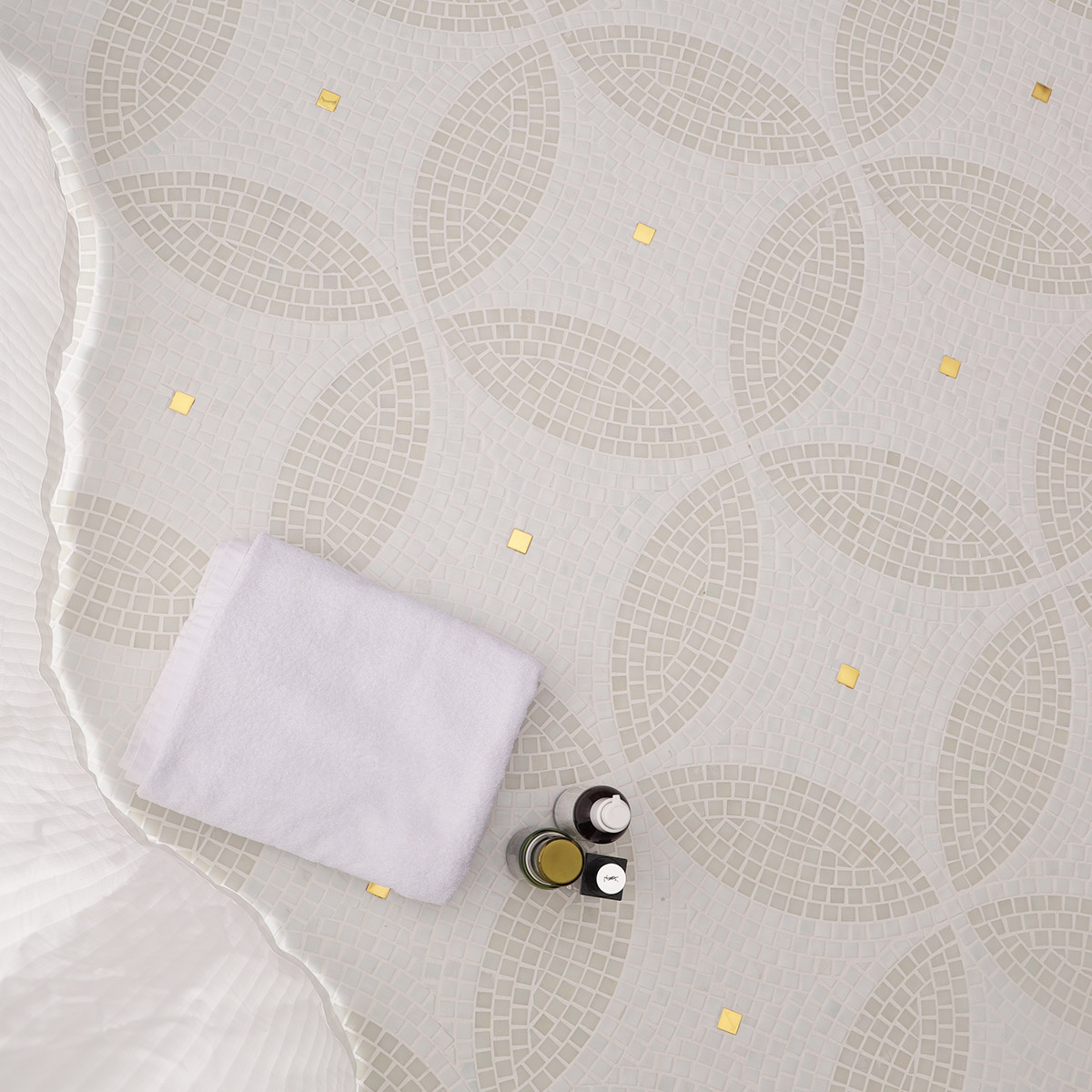 Scene featuring white glass mosaic art patterns on the floor