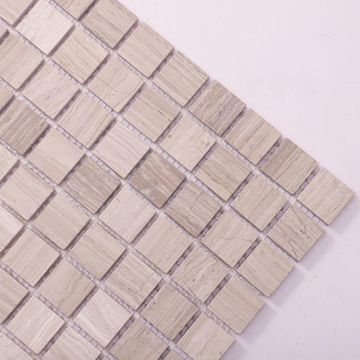 Detailed close-up of Grigio Legno square marble mosaic tiles.